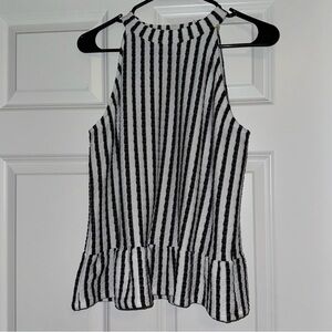 Large white and black striped blouse.
